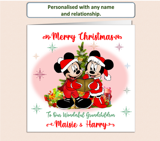 Mickey and Minnie Mouse dressed in a Christmas outfit next to a Christmas Tree