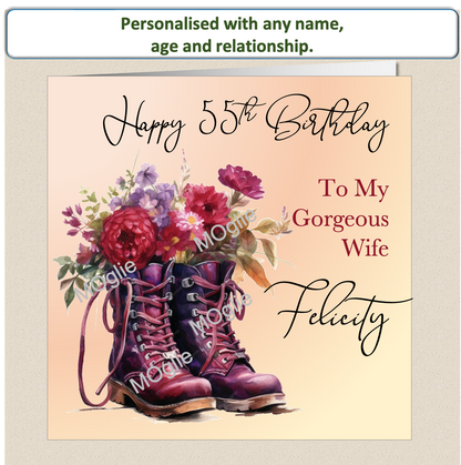 Floral birthday card. Brown walking boot brimming with red flowers.