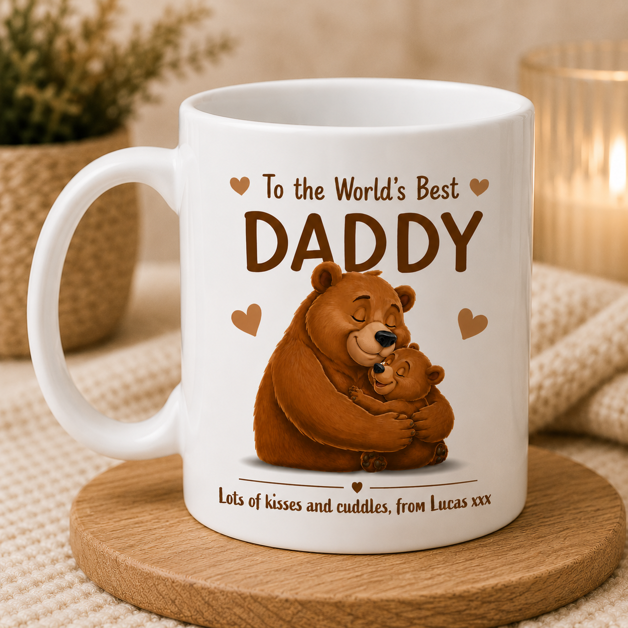 White mug with bear illustration and text 'To the World's Best DADDY' on a wooden coaster.