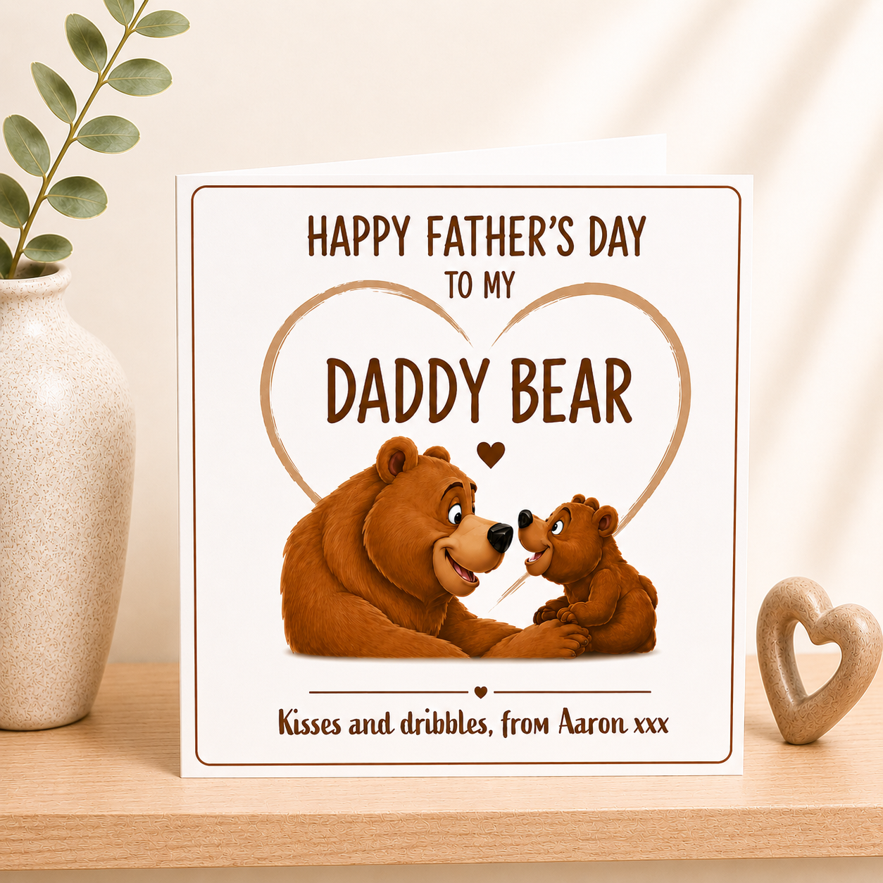 Father's Day card with illustration of a bear and cub on a wooden surface with decorative elements.