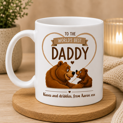 White mug with bear design and text on a wooden coaster