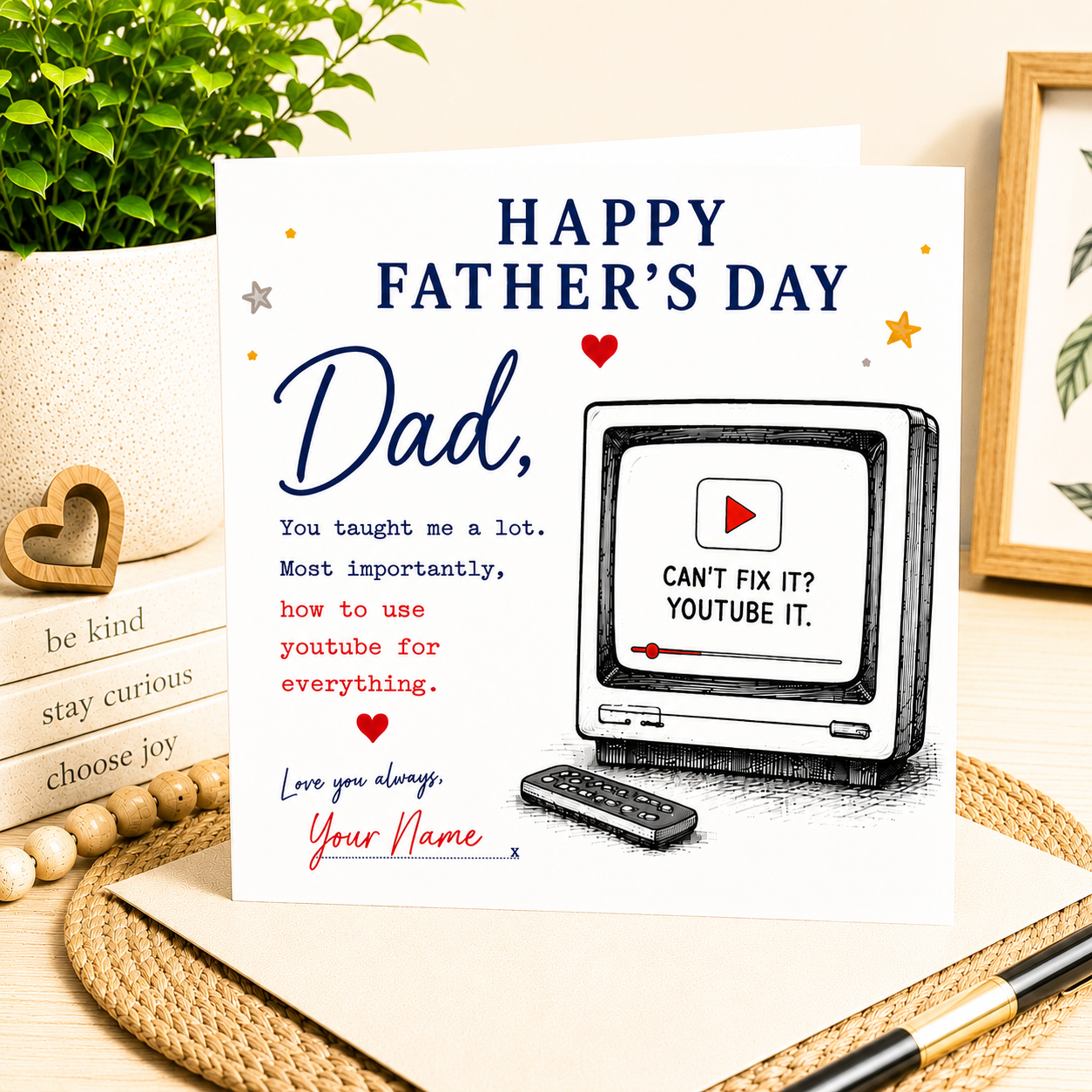 Father's Day card with a TV and remote control illustration on a wooden surface.