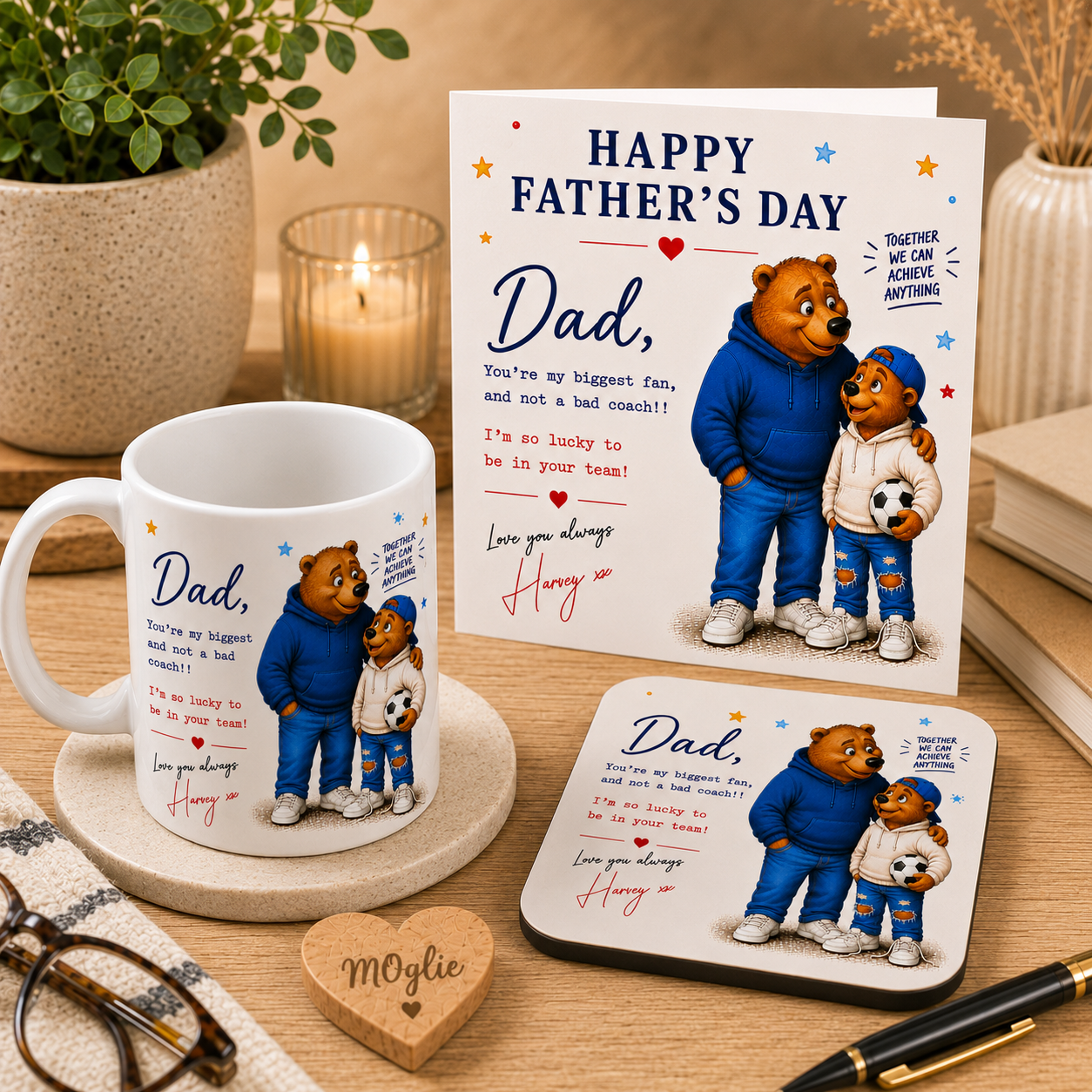 Father's Day card with bear illustration, mug, and coaster on a wooden surface.