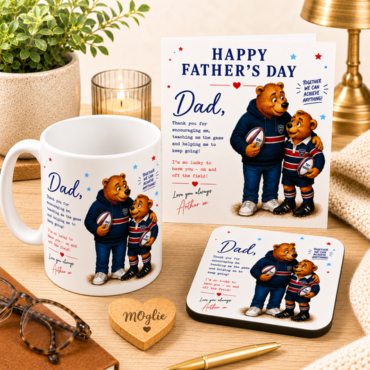 Father's Day gift set with mug, card, and coaster featuring bear illustrations on a wooden surface.